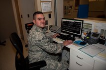 Senior Airman Luis Poblano, 5th Medical Support Squadron laboratory technician, poses at the front desk of the lab at Minot Air Force Base, N.D., July 8, 2015. Manning the front desk is one of many duties Poblano holds including urinalysis, microbiology and others. (U.S. Air Force photo/Airman 1st Class Christian Sullivan)