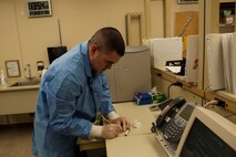 Senior Airman Luis Poblano, 5th Medical Support Squadron laboratory technician, labels a blood sample at Minot Air Force Base, N.D, July 8, 2015. Though the Minot clinic is small they stay routinely busy, averaging anywhere from 15 to 45 patients a day, but handle it very well for a low-manned shop. (U.S. Air Force photo/Airman 1st Class Christian Sullivan)