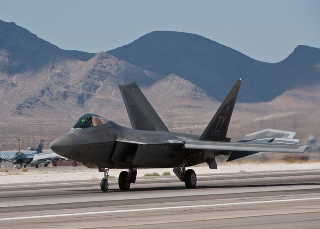 An F-22 Raptor assigned to the 95th Fighter Squadron, Tyndall Air Force Base, Fla., lands on the runway after returning from a Red Flag 15-3 sortie at Nellis AFB, Nev., July 17, 2015. Red Flag is a realistic combat training exercise involving the air, space and cyber forces of the U.S. and its allies, and is conducted on the vast bombing and gunnery ranges on the Nevada Test and Training Range during day and night operations. (U.S. Air Force photo by Airman 1st Class Jake Carter)