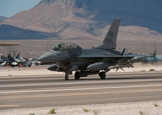 An F-16 Fighting Falcon assigned to the 55th Fighter Squadron, Shaw Air Force Base, S.C., lands on the runway after returning from a Red Flag 15-3 sortie at Nellis AFB, Nev., July 17, 2015. Red Flag provides combat training in a degraded and operationally limited environment making the training missions as realistic as possible. (U.S. Air Force photo by Airman 1st Class Jake Carter)
