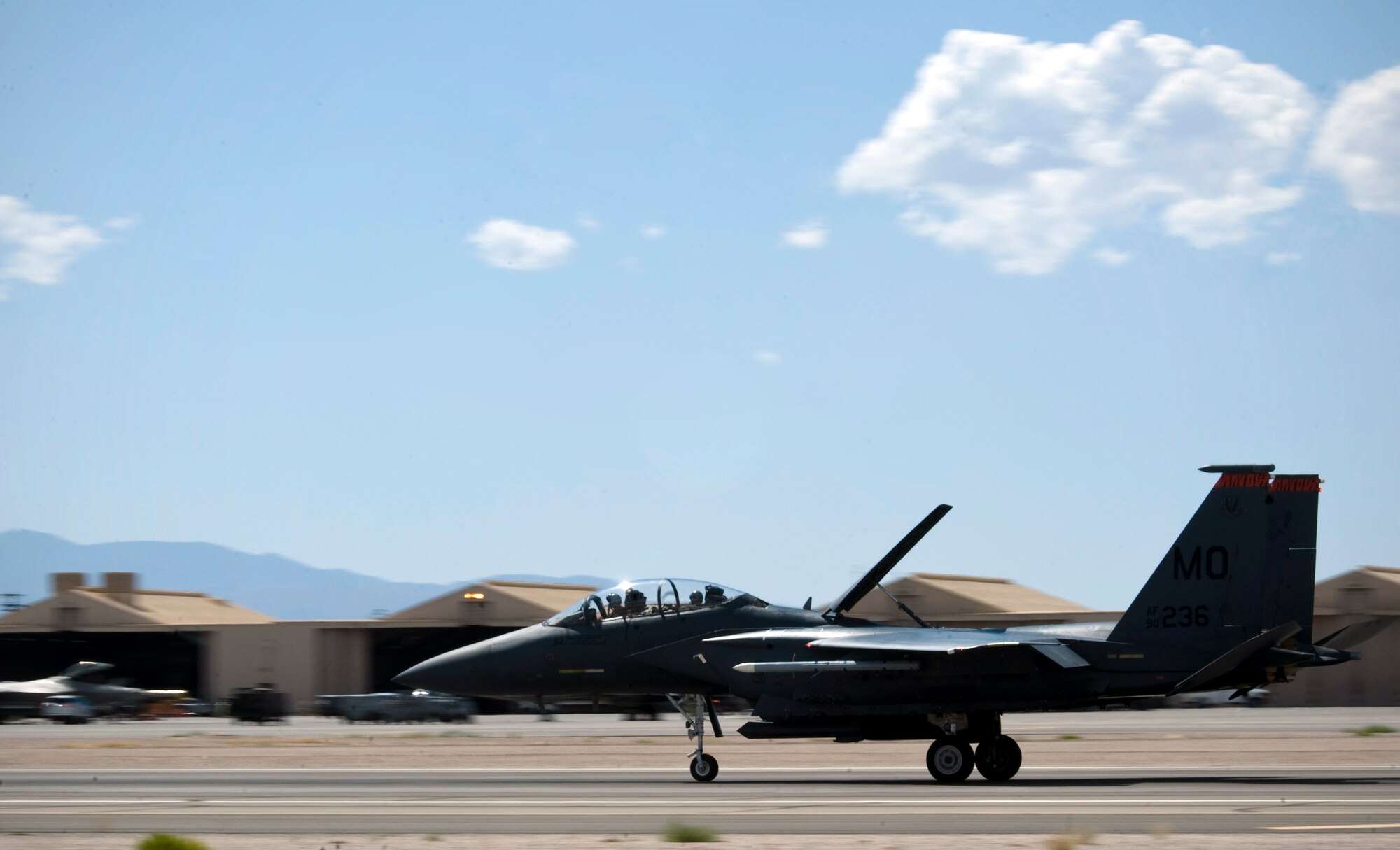An F-15E Strike Eagle assigned to the 391st Fighter Squadron, Mountain Home Air Force Base, Idaho, lands on the runway after returning from a Red Flag 15-3 sortie at Nellis AFB, Nev., July 17, 2015. Red Flag is a realistic combat training exercise involving the air, space and cyber forces of the U.S. and its allies, and is conducted on the vast bombing and gunnery ranges on the Nevada Test and Training Range. (U.S. Air Force photo by Airman 1st Class Rachel Loftis)