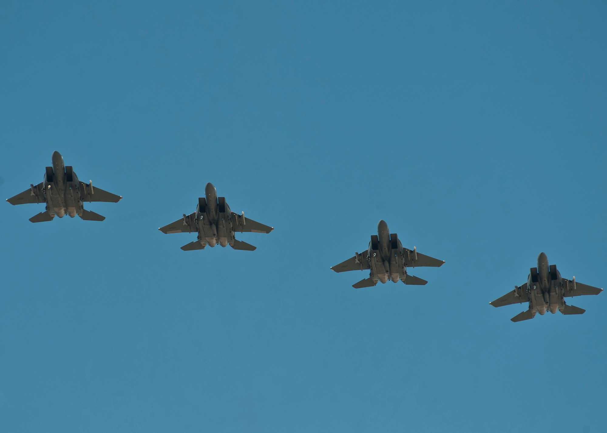 Four F-15E Strike Eagles assigned to the 366th Fighter Wing, Mountain Home Air Force Base, Idaho, fly during a Red Flag 15-3 sortie at Nellis AFB, Nev., July 17, 2015. Red Flag provides realistic combat training in a contested, degraded and operationally-limited environment, which provides aircrews with real-time war scenarios and helps ground crews test and improve their operational readiness. (U.S. Air Force photo by Staff Sgt. Siuta B. Ika)