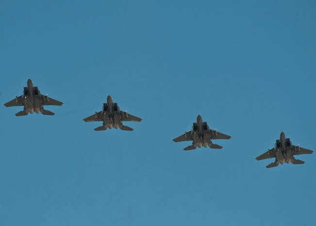 Four F-15E Strike Eagles assigned to the 366th Fighter Wing, Mountain Home Air Force Base, Idaho, fly during a Red Flag 15-3 sortie at Nellis AFB, Nev., July 17, 2015. Red Flag provides realistic combat training in a contested, degraded and operationally-limited environment, which provides aircrews with real-time war scenarios and helps ground crews test and improve their operational readiness. (U.S. Air Force photo by Staff Sgt. Siuta B. Ika)