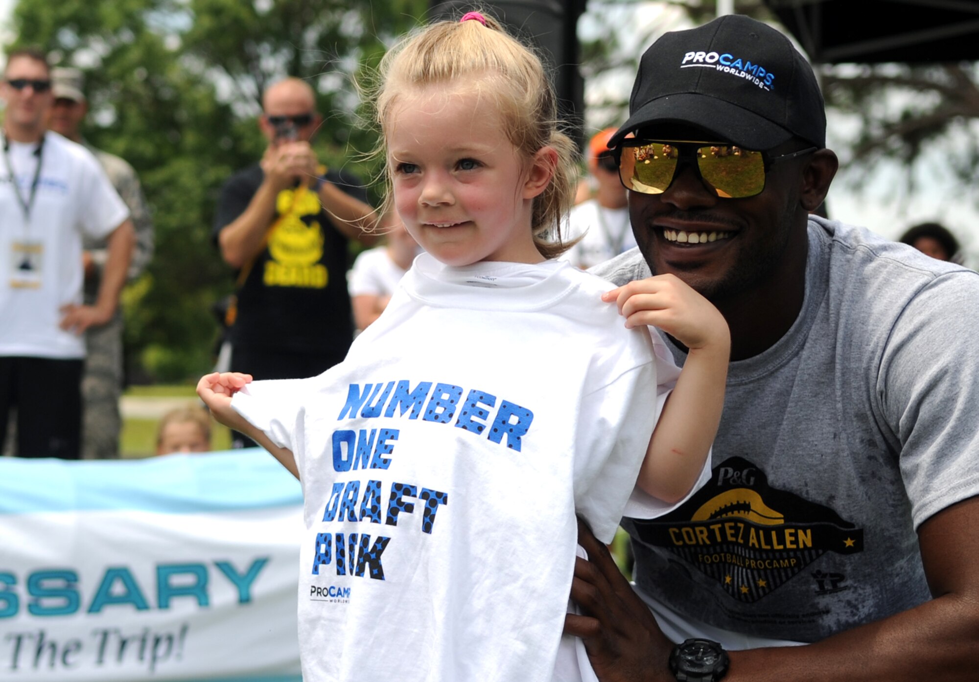 A National Football League ProCamp’s number-one draft pick poses with Cortez Allen, Pittsburgh Steelers defensive back, July 16, 2015, at Seymour Johnson Air Force Base, North Carolina. The camp began with a draft, similar to the draft conducted before every NFL season. (U.S. Air Force photo/Senior Airman Ashley J. Thum)