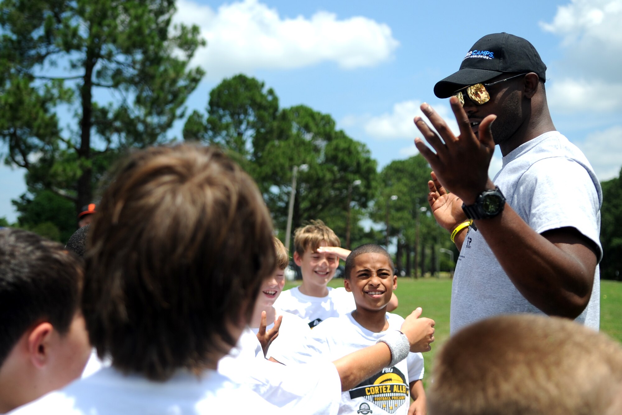 Cortez Allen, Pittsburgh Steelers defensive back, hypes up young athletes at the start of a National Football League ProCamp, July 16, 2015, at Seymour Johnson Air Force Base, North Carolina. The free, two-day camp instilled leadership and teamwork skills into children in grades one through eight. (U.S. Air Force photo/Senior Airman Ashley J. Thum)