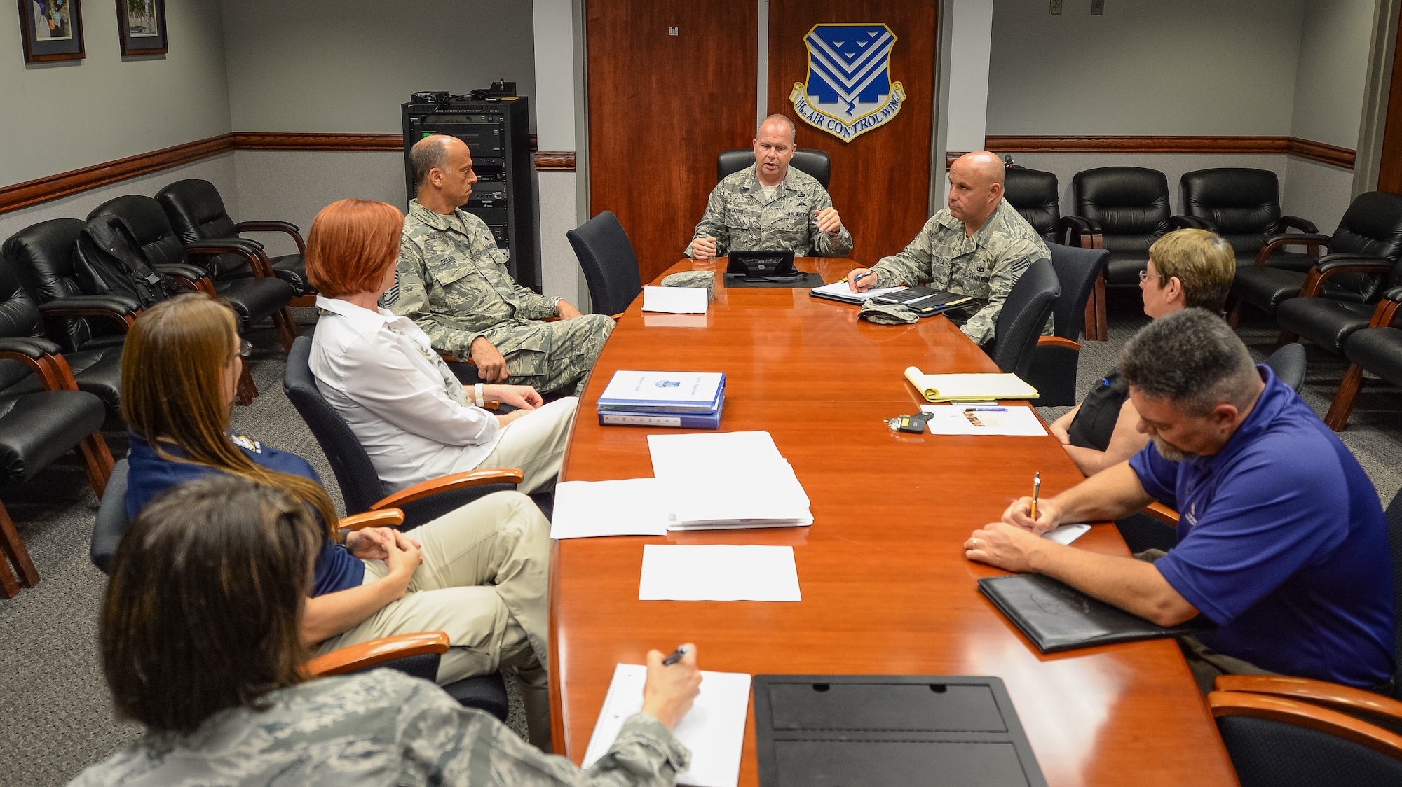 U.S. Air Force Chief Master Sgt. James W. Hotaling, Air National Guard command chief, talks with leaders from the 116th Air Control Wing (ACW), Georgia Air National Guard, Family Readiness, Psychological Health, Yellow Ribbon, Wing Chief of Staff, Public Affairs and the 116th ACW command chief about resiliency and how their departments are doing during a visit to Robins Air Force Base, Ga., July 16, 2015. During his visit, Hotaling conducted two town hall style meetings and met with key enlisted leadership councils and Airmen resiliency representatives. His time with the Airmen focused on sharing his message of a renewed commitment to the profession of arms, health of the force, and recognition of our Airmen and accomplishments. The visit offered the opportunity for Airmen in the wing to meet their top leader, share their concerns and gain perspective from the national level. (U.S. Air National Guard photo by Tech. Sgt. Regina Young/Released)