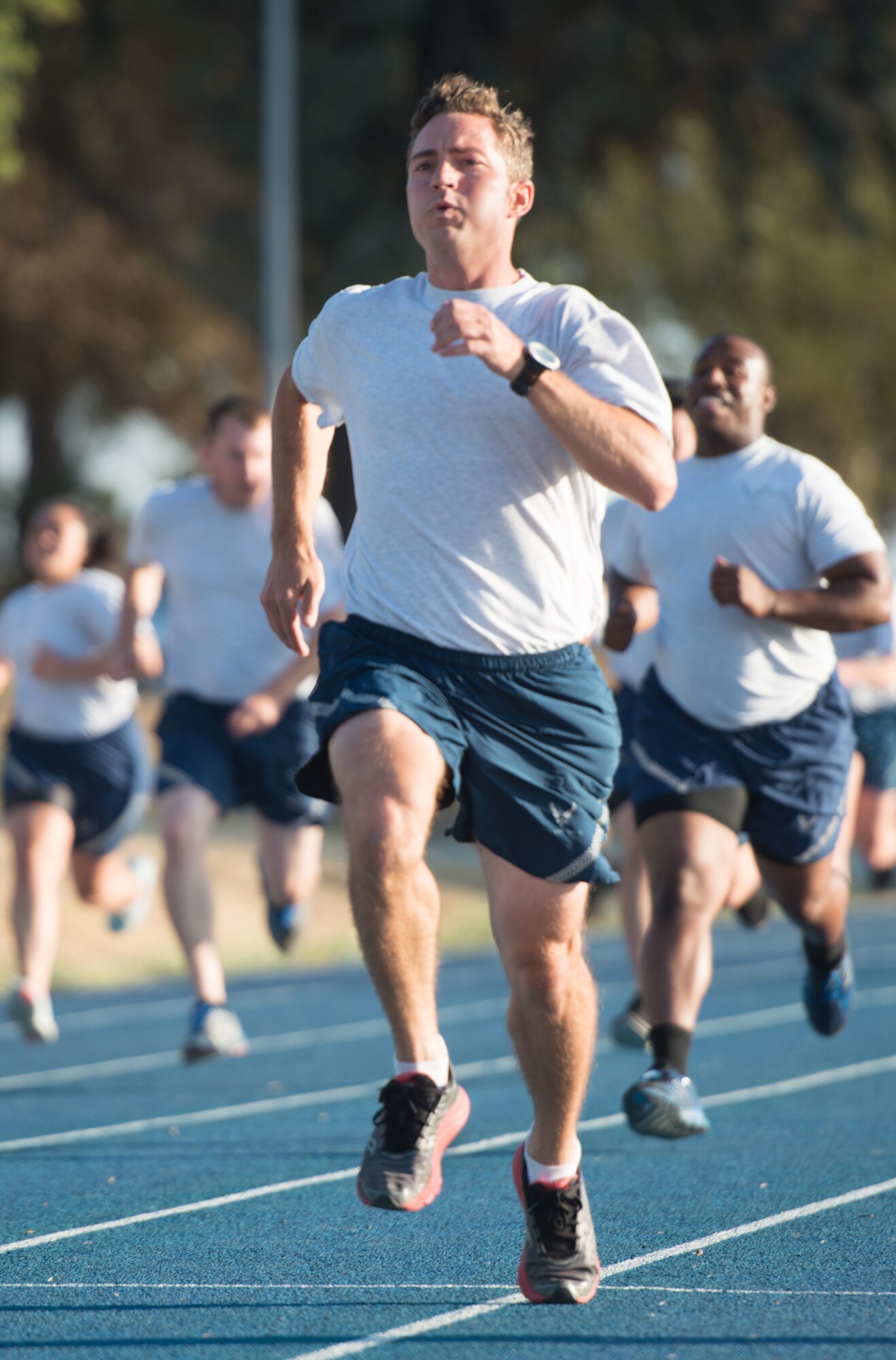 Capt. Caleb Bury, 921st Contingency Response Squadron operations flight commander, sprints to the finish line during physical training July 15, 2015 at Travis Air Force Base, California. (U.S. Air Force photo/Ken Wright)