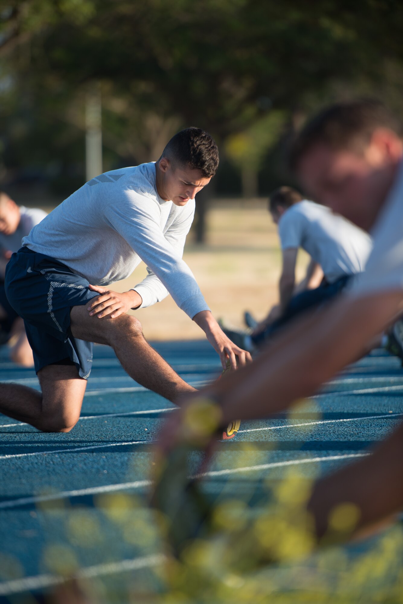 Senior Airman Corey Andersen, 921st Contingency Response Squadron crew chief, leads his unit though stretching exercises prior to a morning run July 15, 2015 at Travis Air Force Base, California. (U.S. Air Force photo/Ken Wright)