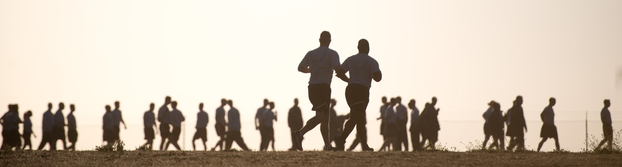 Airmen from the 921st Contingency Response Squadron run laps around a track early July 15, 2015 during their unit's twice-weekly physical training at Travis Air Force Base, California. With a high operations tempo, physical fitness is key to Airmen maintaining resiliency. They Mayo Clinic suggests that coupled with a healthy diet and 7-8 hours of uninterrupted nightly sleep, an active lifestyle can help reduce stress and lead to a healthier and longer life. (U.S. Air Force photo/Ken Wright)
