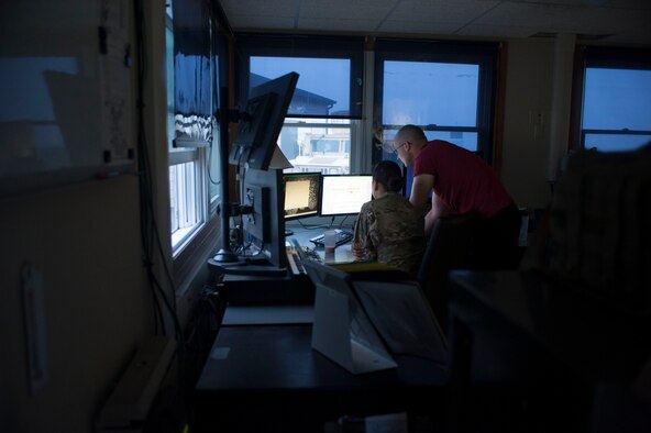 Senior Airman Jessica Flores (left), and Staff Sgt. William Fraas (right), 91st Missile Security Forces Squadron flight security controllers, review a roster at Bravo-01 Missile Alert Facility near Ruso, N.D., July 1, 2015. FSCs are charged with controlling access to all launch facilities, MAFs and the security control center within their assigned flight area. (U.S. Air Force photo/Senior Airman Stephanie Morris) 