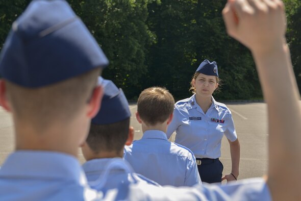 Abigail Murray, Civil Air Patrol cadet, answers another cadet’s question in a drill and ceremony test during the CAP’s 2015 European Summer Camp June 24, 2015, at Ramstein Air Base, Germany. Murray served as an NCO in charge during the test and led one of the two groups testing. (U.S. Air Force photo/Airman 1st Class Lane T. Plummer)