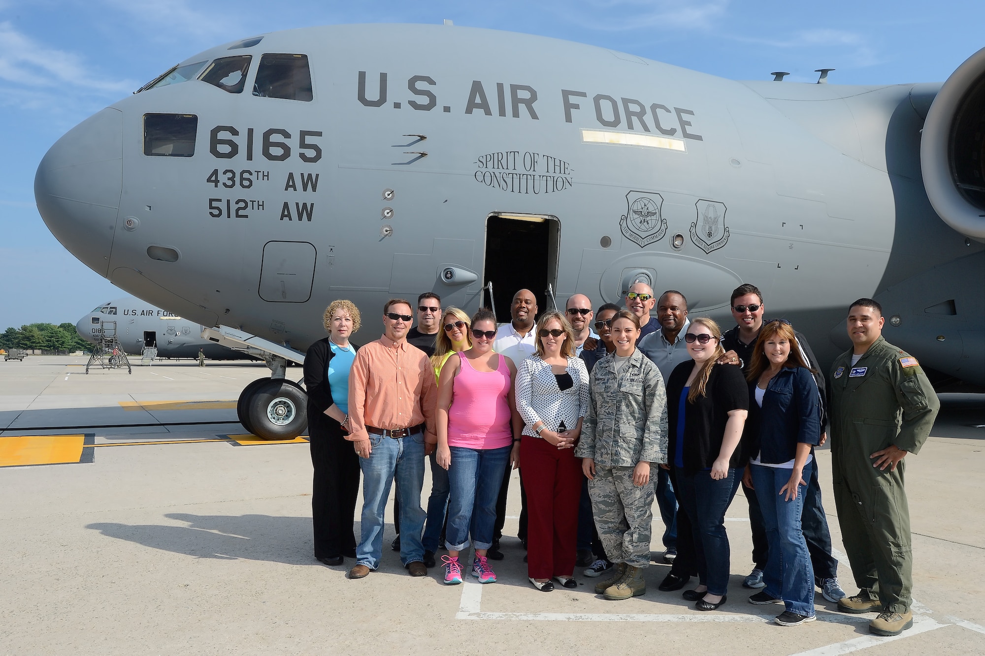 The Leadership Central Delaware Class of 2015 poses for a group photo prior to boarding a C-17 Globemaster III, operated by the 436th Airlift Wing, July 13, 2015, on Dover Air Force Base, Del. The local civilian leaders gained a better understanding of the Eagle Wing's mission and how it is executed during the flight and subsequent tour of various units. (U.S. Air Force photo/Greg L. Davis)