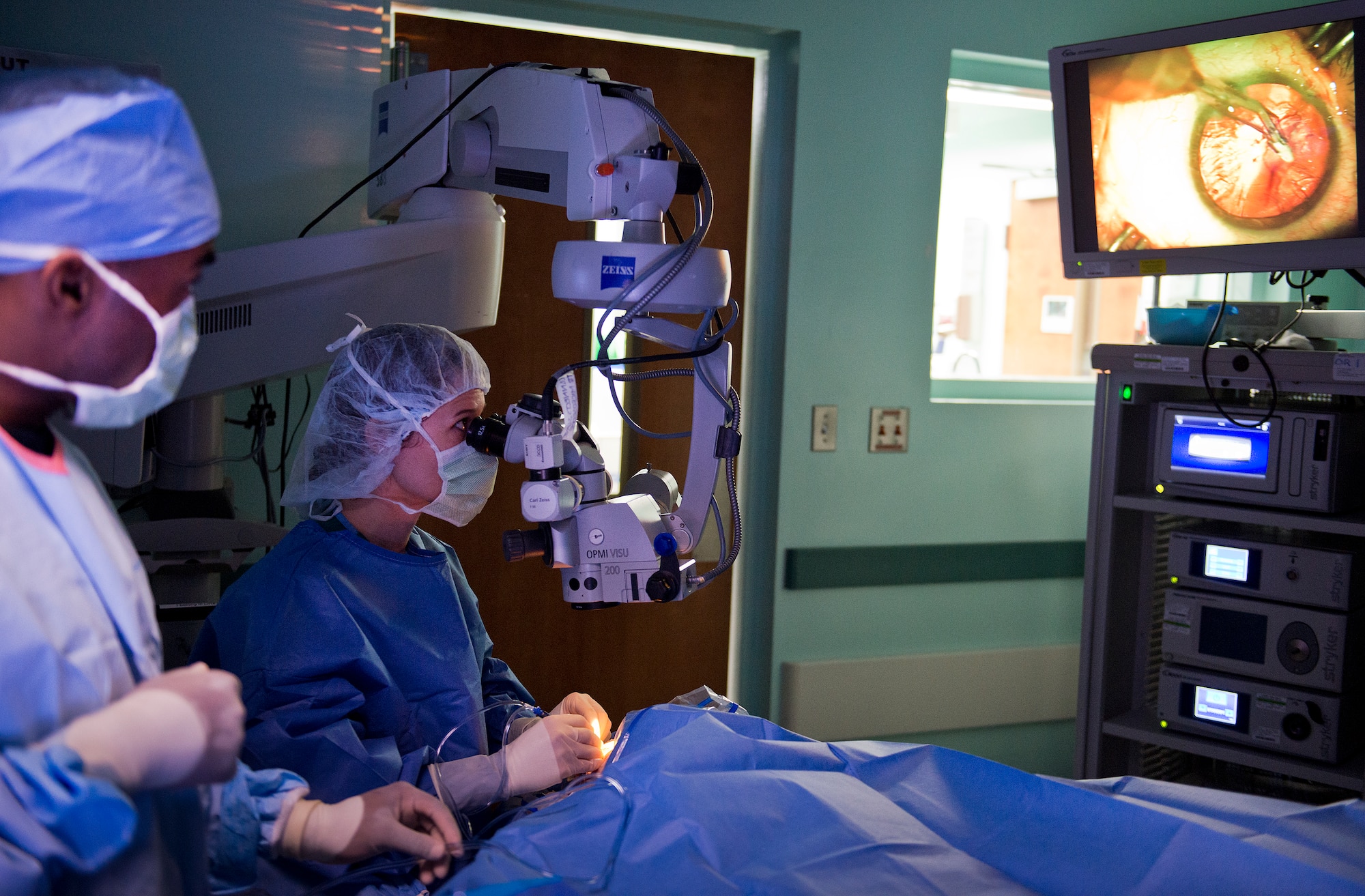 Maj. Sarah Eccles-Brown, 96th Surgical Operations Squadron,  removes cortex, the outer layers of the cataract, during a cataract surgery at Eglin Air Force Base, Fla.  During the procedure, the surgeon removes the eye’s cloudy lens known as a cataract and replaces it with a new clear lens implant.  The surgery takes approximately 20 minutes.  The 96th Medical Group performs approximately 150 cataract surgeries per year.  (U.S. Air Force photo/Samuel King Jr.)