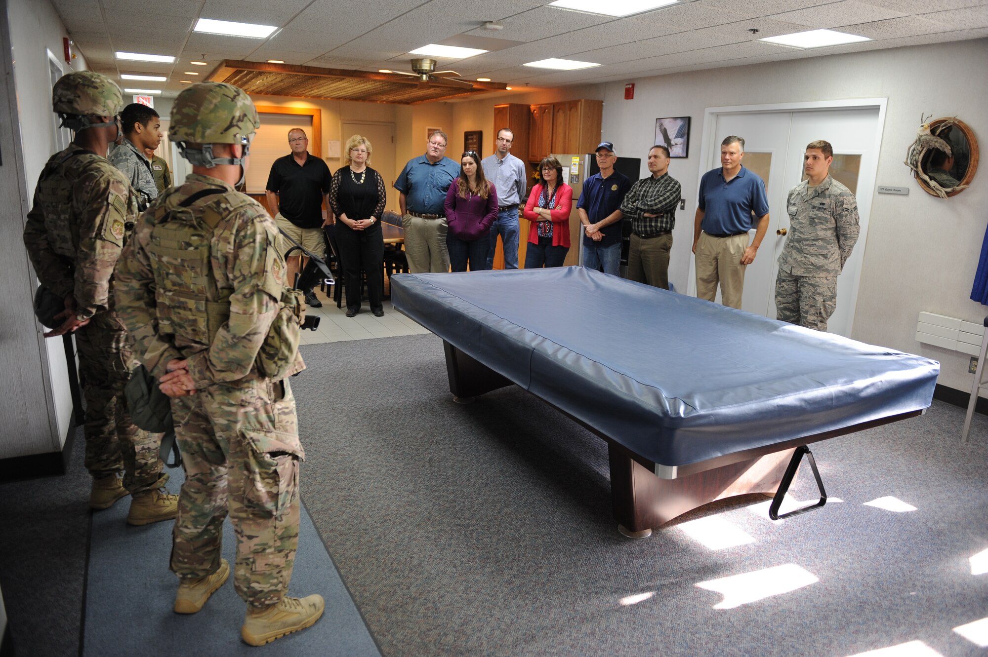 Members of the Minot community receive a briefing from 91st Missile Wing security forces squadron members regarding responsibilities at a Missile Alert Facility near Glenburn, N.D., July 15, 2015. Members toured a missile alert facility as well as a missile trainer facility on base to better understand the 91st Missile Wing’s mission of defending the United States with safe, secure nuclear-capable intercontinental ballistic missiles, ready to immediately put bombs on target. (U.S. Air Force photo/Senior Airman Kristoffer Kaubisch)