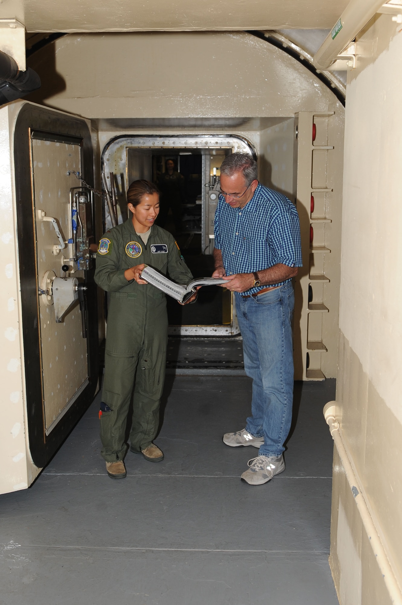 2nd Lt. Amy Hunt, 742nd missile squadron missileer, briefs the responsibilities of a missileer to Chuck Barney, Mayor of Minot, at a missile alert facility near Glenburn, N.D. July 15, 2015. Members of the Minot community toured a missile alert facility as well as a missile trainer facility on base to better understand the 91st Missile Wing’s mission of defending the United States with safe, secure nuclear-capable intercontinental ballistic missiles, ready to immediately put bombs on target. (U.S. Air Force photo/Senior Airman Kristoffer Kaubisch)
