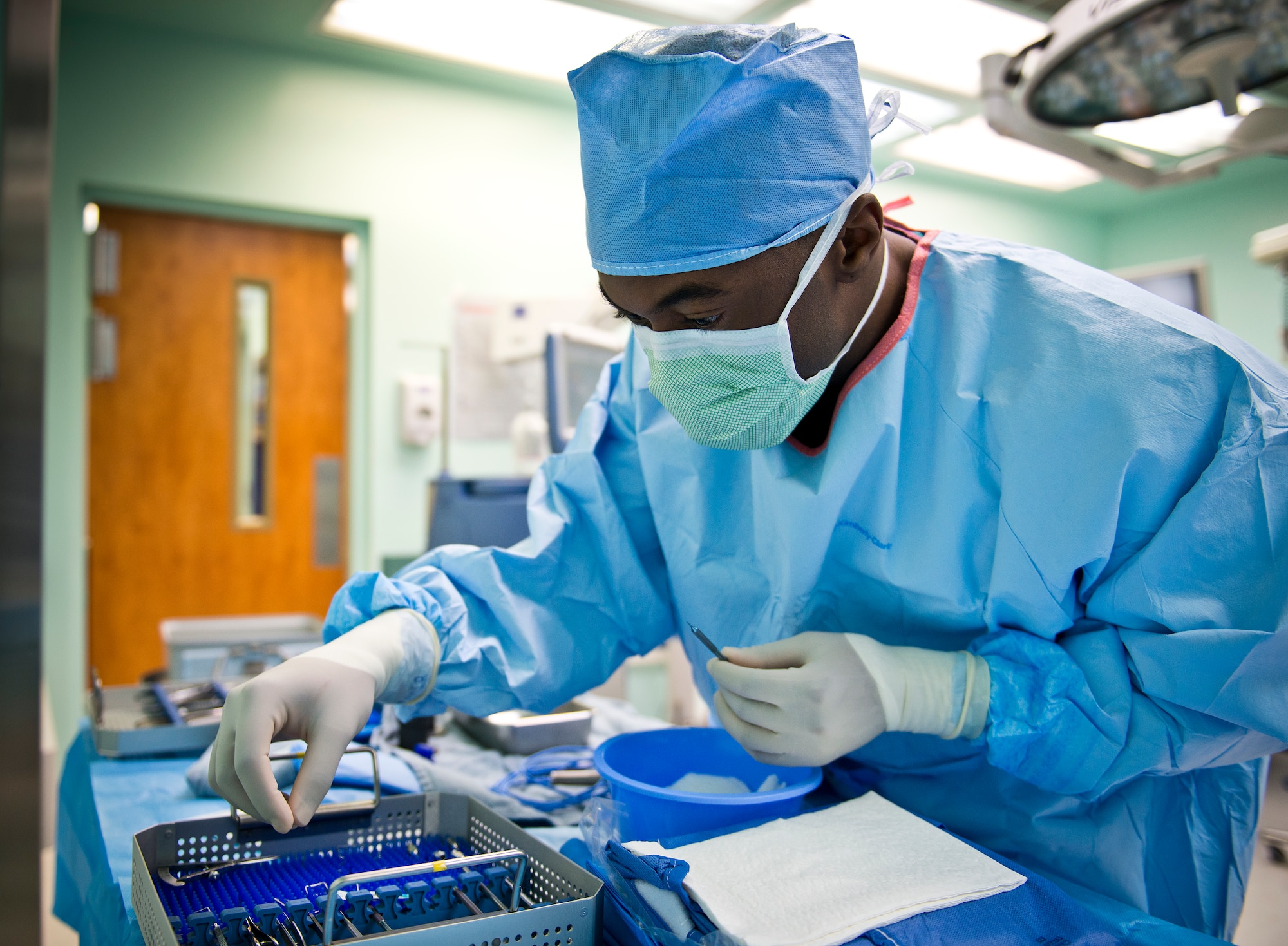 Senior Airman James Bohannon, 96th Aerospace Medicine Squadron, gathers the proper instruments in preparation for a surgical procedure at the Eglin Air Force Base hospital.  (U.S. Air Force photo/Samuel King Jr.)