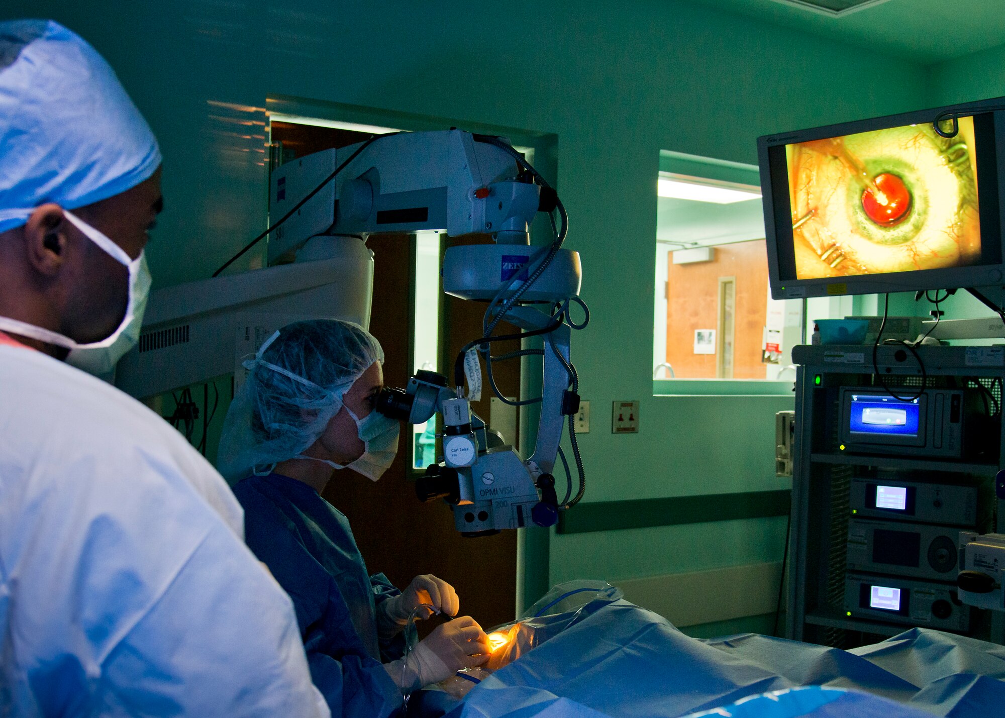 Maj. Sarah Eccles-Brown, 96th Surgical Operations Squadron, centers a toric lens implant in the eye to treat astigmatism during a cataract surgery at Eglin Air Force Base, Fla.  During the procedure, the removes the eye’s cloudy lens known as a cataract and replaces it with a new clear lens implant.  The surgery takes approximately 20 minutes.  The 96th Medical Group performs approximately 150 cataract surgeries per year.  (U.S. Air Force photo/Samuel King Jr.)