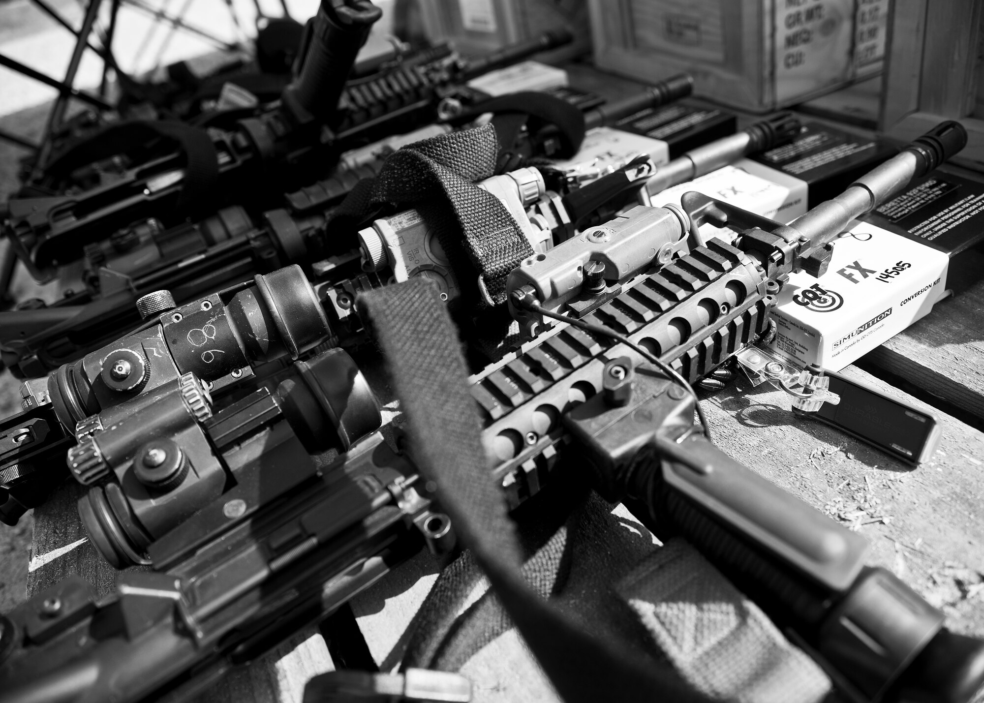 M-4 rifles sit ready for use by 96th Security Forces Squadron Airmen prior to a shoot, move and communicate drill at Eglin Air Force Base, Fla.  The mandatory training requirement is in addition to annual weapons qualification training.  The exercise consists of Airmen firing simmunition ammo while advancing toward, away from and to the side of a target.  This is followed by a building sweep and clear drill.  The Defenders perform the highly kinetic training at Eglin’s Base Tango range.  The range was previously used for security forces pre-deployment training.  (U.S. Air Force photo/Samuel King Jr.)
