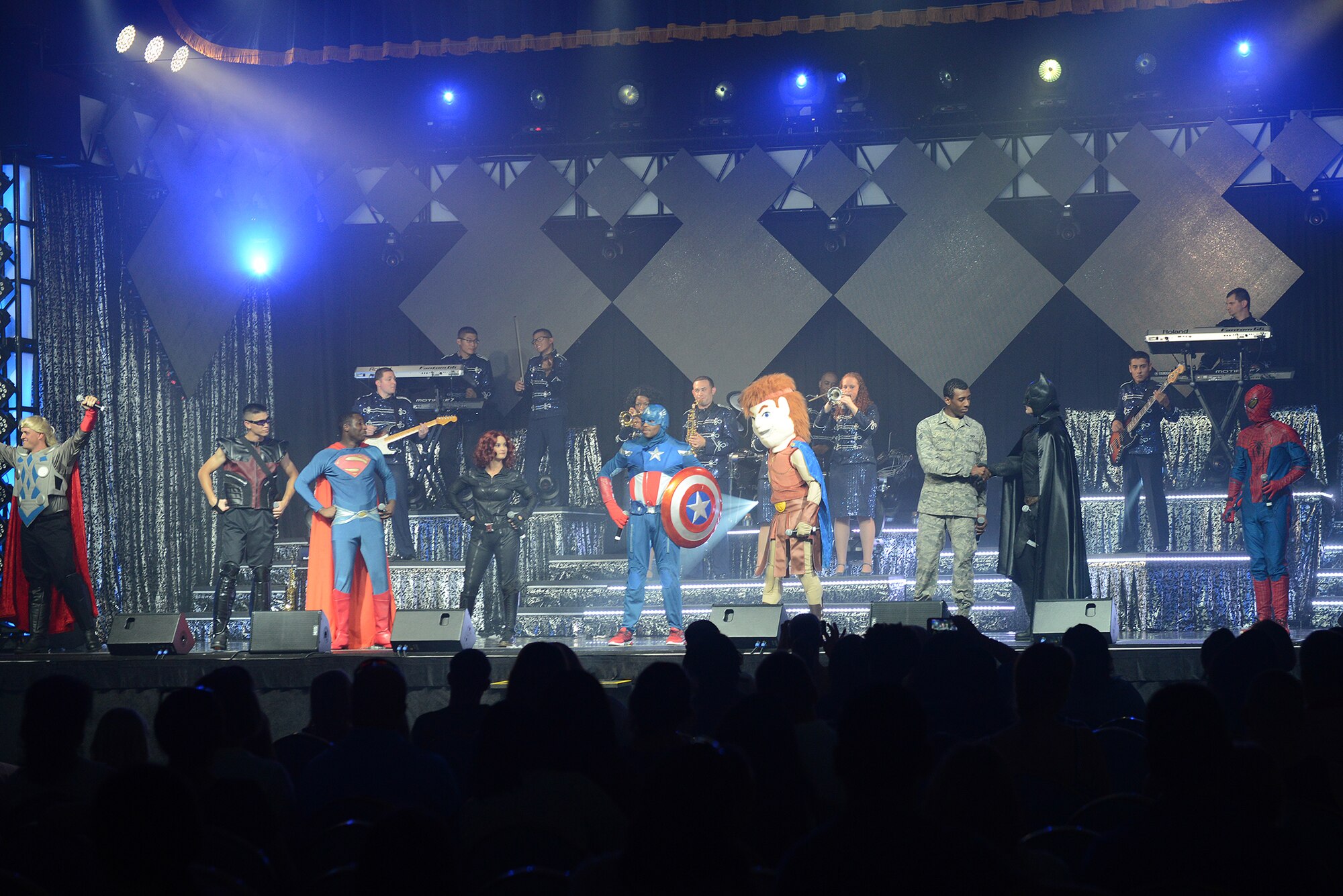 Members of the Tops in Blue dress as super heroes during their performance at Yokota Air Base, Japan, July 19, 2015. The show culminated in several songs paying tribute to U.S. service members. (U.S. Air Force photo by Airman 1st Class David C. Danford/Released)
