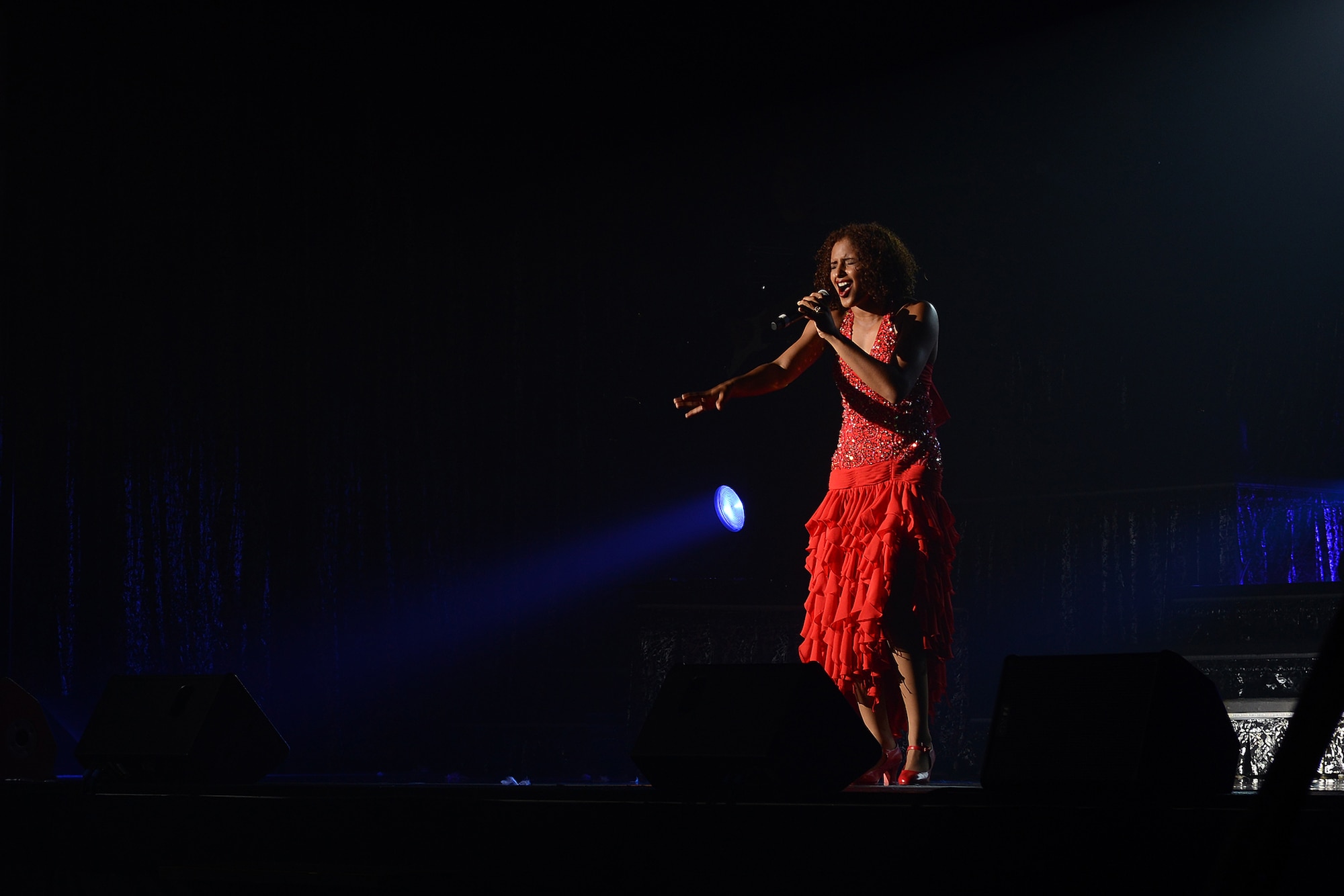 A vocalist with Tops in Blue performs Donna Summer's "Last Dance" at Yokota Air Base, Japan, July 19, 2015. The show’s theme was America's musical history through the 20th century. (U.S. Air Force photo by Airman 1st Class David C. Danford/Released)