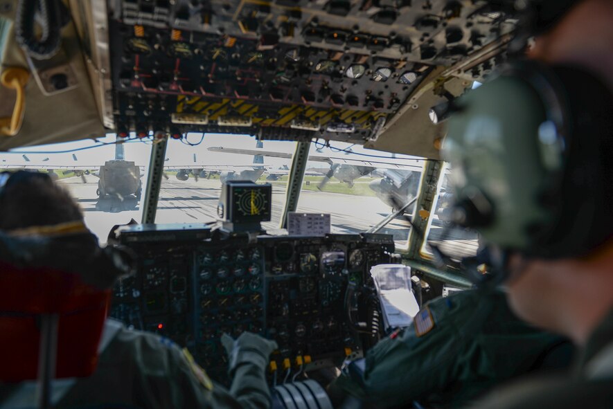 A C-130 Hercules aircrew prepares for takeoff at Yokota Air Base, Japan, July 14, 2015. The C-130 was one of nine to take off during the mission to practice Yokota’s ability to conduct large formation flights. (U.S. Air Force photos by Airman 1st Class Elizabeth Baker/Released)