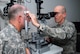 Lt. Col. Steven Weekes, an optometrist with the 178th Medical Group, performs an eye exam on a U.S. Army Soldier at Landstuhl Regional Medical Center in Germany, July 15, 2015. The 178th Wing's Medical Group temporarily deployed to Ramstein Air Base to train and provide support at the LRMC. (Ohio Air National Guard photo by Airman Rachel Simones/Released)