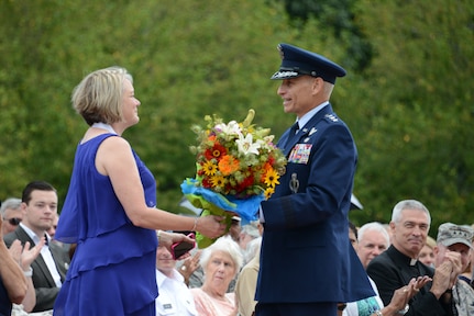 U.S. Air Force Lt. Gen. James M. Kowalski (right), U.S. Strategic Command deputy commander, presents flowers to his wife, Julanne, during his retirement ceremony at the parade field, Offutt Air Force Base, Neb., July 20, 2015. During the ceremony ceremony, Kowalski thanked his family, friends, and fellow service members for supporting him throughout his distinguished, more than 35-year military career. His effective date of retirement is Sept. 1, 2015. Kowalski arrived at USSTRATCOM in Oct., 2013, after serving as Air Force Global Strike Command commander, Barksdale Air Force Base, La. Once officially retired, he and Julanne will reside in the greater Washington, D.C. area. USSTRATCOM is one of nine DoD unified combatant commands and is charged with strategic deterrence; space operations; cyberspace operations; joint electronic warfare; global strike; missile defense; intelligence, surveillance and reconnaissance; combating weapons of mass destruction; and analysis and targeting. (USSTRATCOM photo by U.S. Air Force Staff Sgt. Jonathan Lovelady) More photos at https://www.flickr.com/photos/usstratcom/sets/72157656069947426