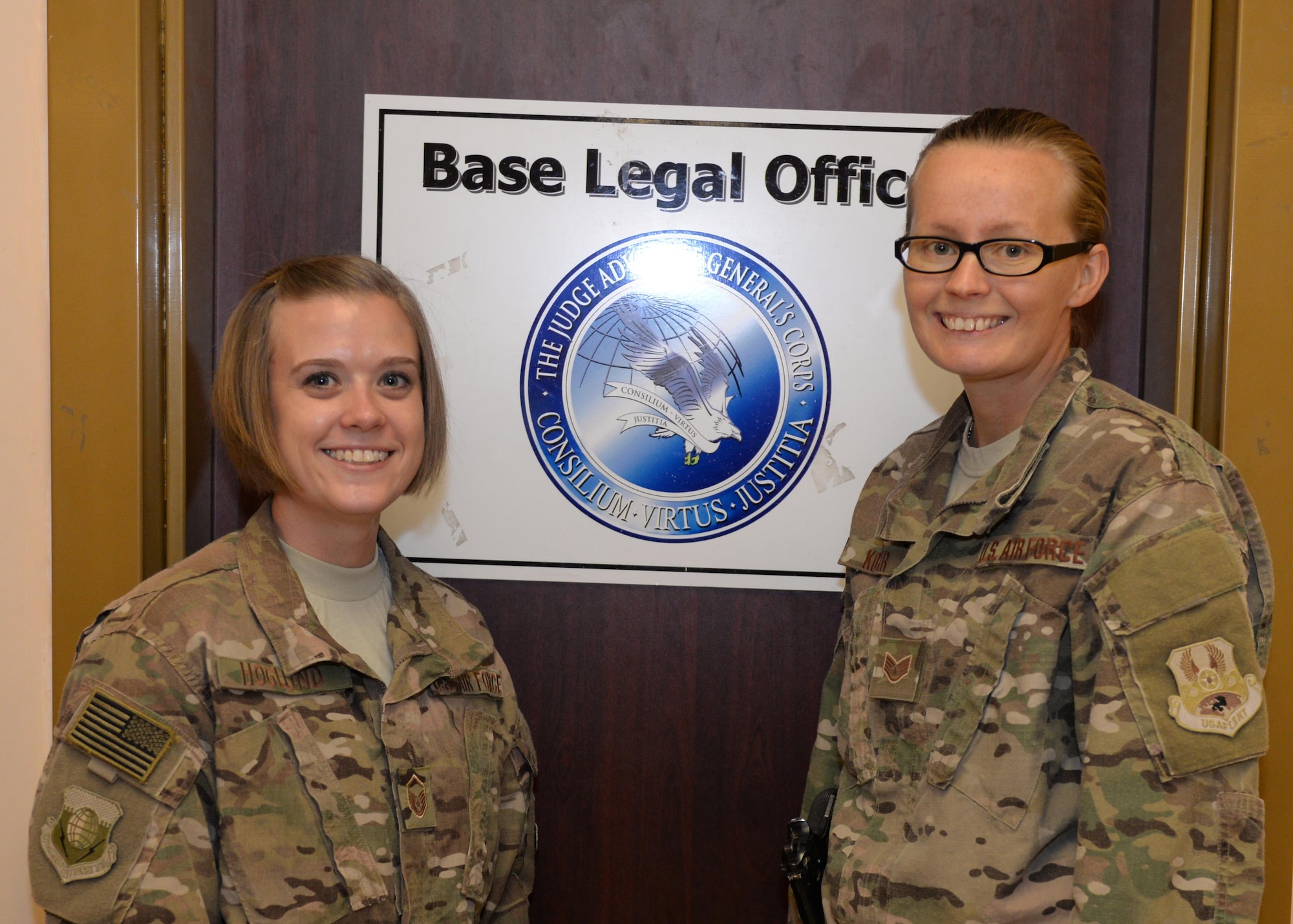 U.S. Air Force Mater Sgt. Natasha Hoglund, left, and Staff Sgt. Angel Kozar, both assigned to the 455th Air Expeditionary Wing Legal Office, pose for a photo July 18, 2015, at Bagram Airfield, Afghanistan. The legal team is here to help military members with legal issues they may be dealing with at home and here in the AOR. (U.S. Air Force photo by Senior Airman Cierra Presentado/Released)