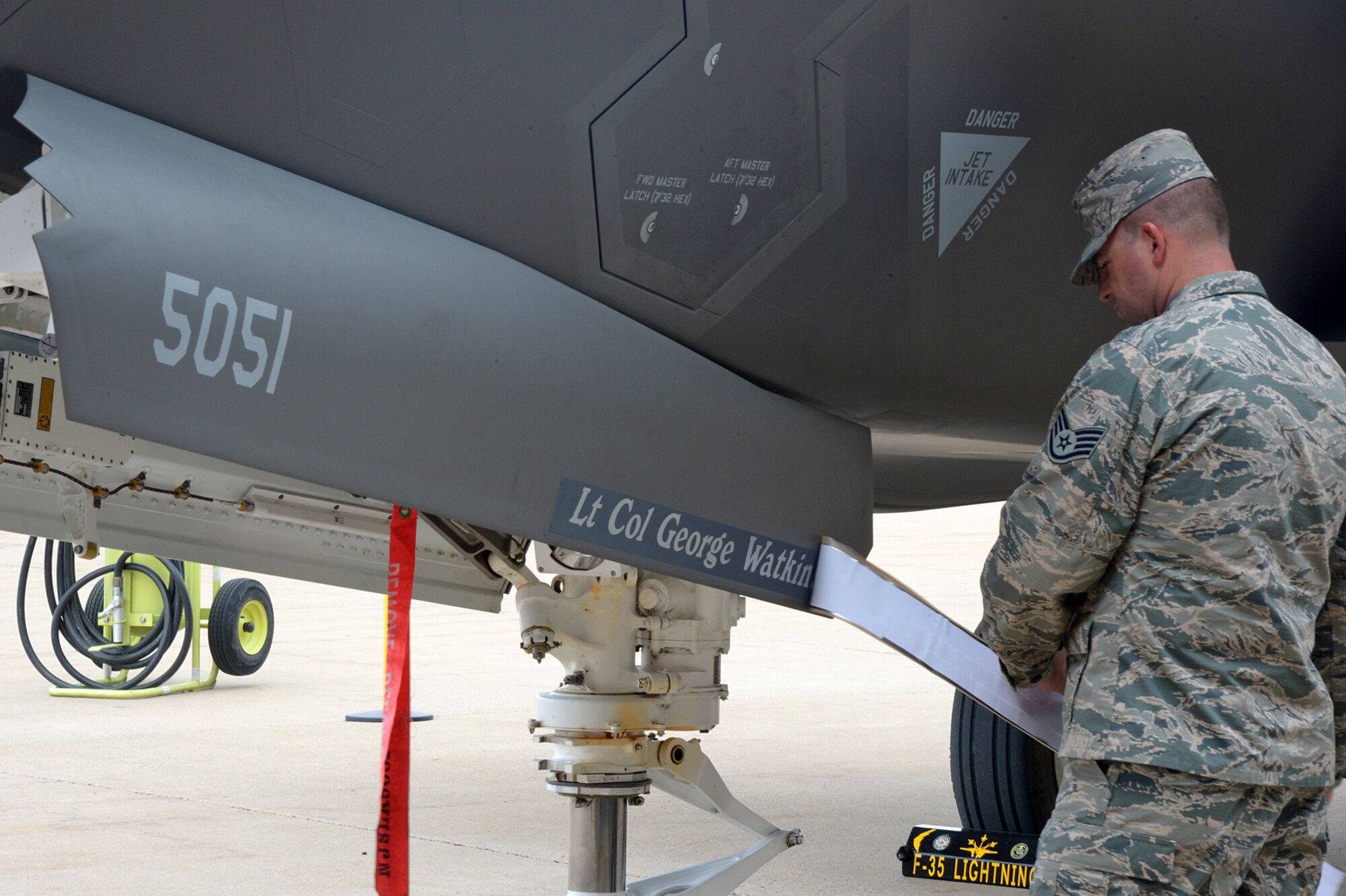 Lt. Col. George R. Watkins, 34th Fighter Squadron commander, has his name revealed on an F-35A by SSgt Bryan Jernigan, Dedicated Crew Chief, 388 AMXS, during the squadron’s activation ceremony July 17 at Hill Air Force Base, Utah. The 34th will be the first combat squadron to fly the Air Force’s newest fighter aircraft, the F-35A. The squadron has an extremely rich history. After many contributions in major U.S. conflicts, the 34th was relocated to Hill AFB on Dec. 8, 1975, where they became the first fighter squadron to receive the F-16 fighter aircraft. The squadron’s first F-35A will arrive in September.  (U.S. Air Force photo by Alex R. Lloyd/Released)