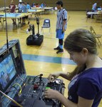 Students operate the Army Talon Ordnance Disposal Robot, mastering their skills on a robot designed to defeat counter-improvised explosive device at the Virginia Demonstration Project STEM summer academy at King George Middle School, King George, Virginia.