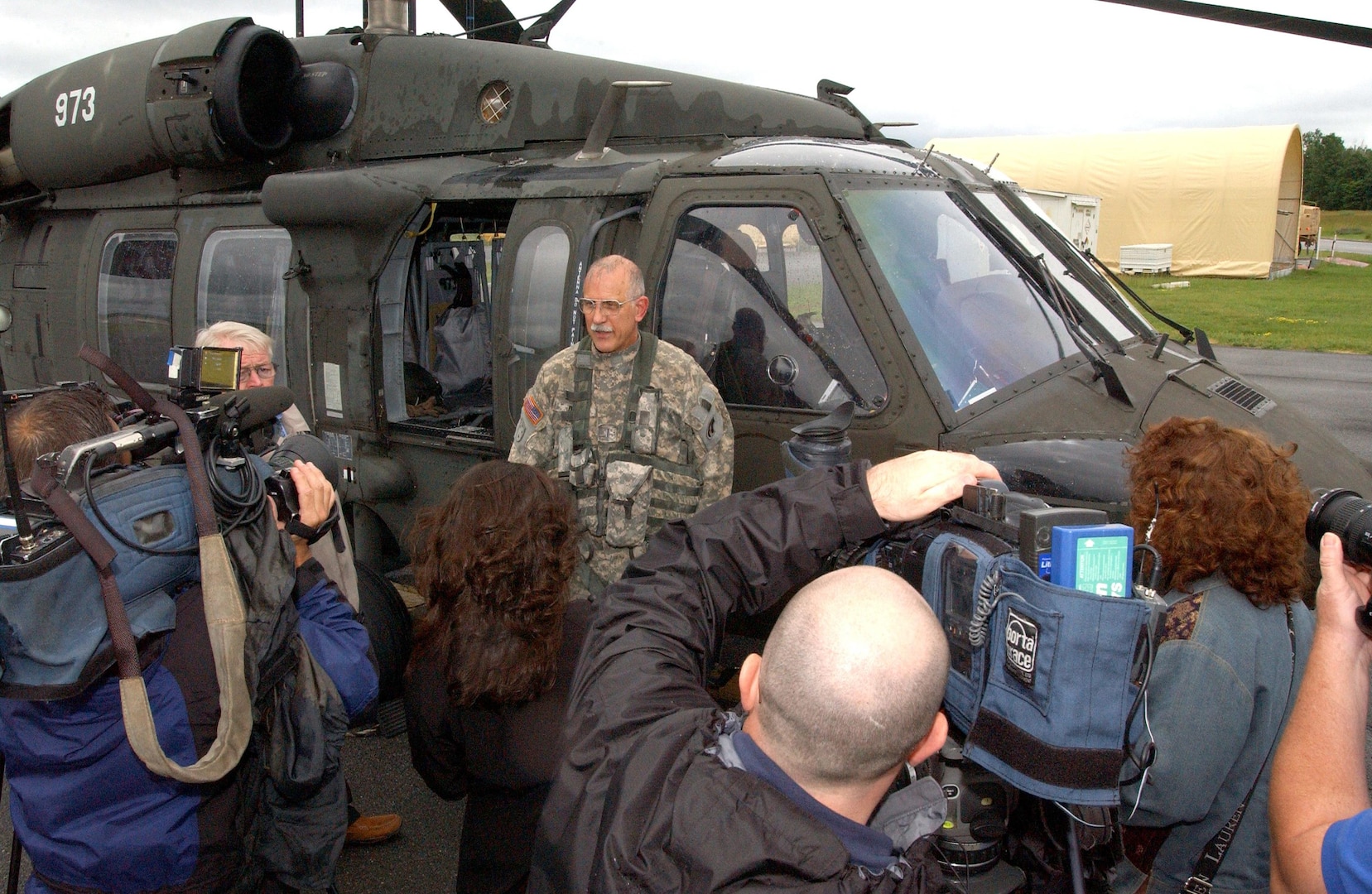 Army Chief Warrant Officer Steven Derry, the last Vietnam-era helicopter pilot in the New York Army National Guard, speaks to members of the Albany press corps following his last official flight as an Army aviation pilot on June 14, 2011. Derry, a member of 3rd Battalion, 142nd Assault Helicopter Battalion, started training as a pilot in 1969 and served in Vietnam in 1970 to 1971.