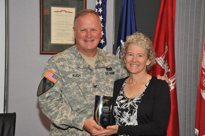 Lynn Daniels was at Huntsville Center July 20 and received an award from Col. Robert Ruch, Huntsville Center commander, recognizing her as the Center's Project Manager of the Year. Daniels is a virtual project manager from Seattle District providing full-time support for the Center’s Facilities Reduction Program. In 2014, she managed projects on eight military installations from Georgia to Alaska, removing 2.8 million square feet of real property (217 facilities) for $22.7 million.