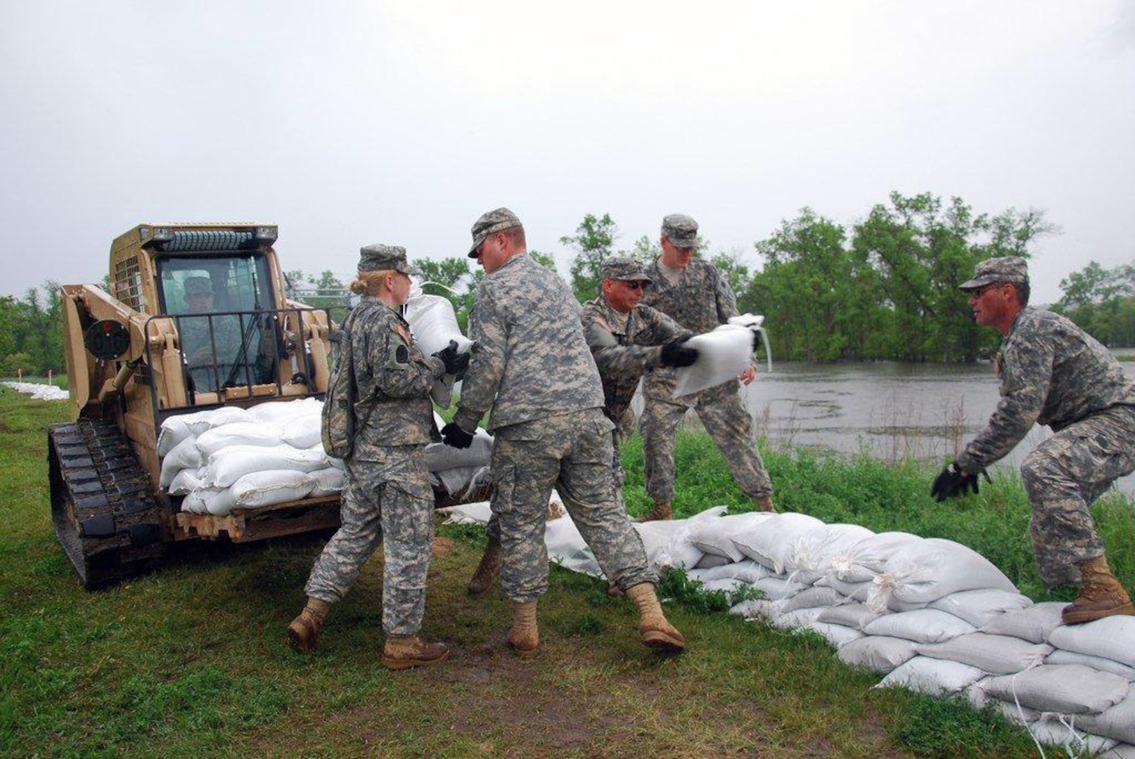 Soldiers of the North Dakota National Guard's 816th Engineer Company (Horizontal) responded to a call June 14, 2011, to perform a sandbagging mission raising the levee near Burlington, N.D. Because of the heavy amounts of rain the state received, the 816th was tasked to raise several low spots on levees throughout their area.