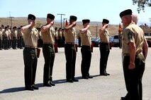 Marines and a Sailor with 2nd Battalion, 4th Marines, 1st Marine Division salute after receiving their awards during a 2/4 Association award ceremony aboard Marine Corps base Camp Pendleton, California, July 17, 2015. Each award given was influenced by a service member in the past that helped create the foundations of leadership within 2/4 in their time. The awards were presented by the 2/4 Association liaison, Col. Jim Williams (Ret). (U.S. Marine Coprs Photo by Cpl Demetrius Morgan/Released)