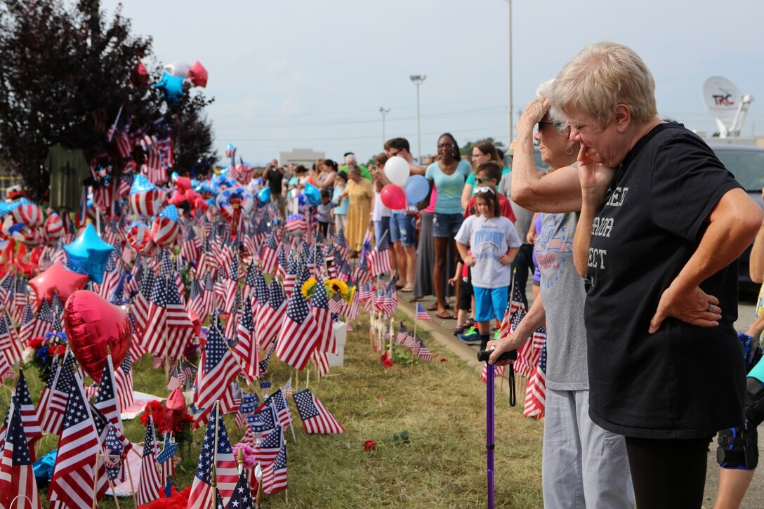 Members of the Chattanooga community gathered at the Naval Operational Support Center and Marine Corps Reserve Center in Chattanooga, Tenn., on July 19, 2015, to honor the fallen Marines and Sailor, who were killed during an attack by a gunman on Thursday. Community members, active duty military and veterans streamed in to place flags, letters, flowers and more to honor and show their support for the military.