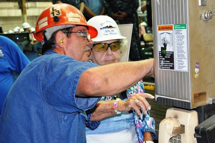 150721-N-EW716-001 (July 21, 2015) PASCAGOULA, Miss. - Mrs. Ima Black, widow of the first Master Chief Petty Officer of the Navy, Delbert Black, begins the mechanized process of cutting the steel plate with the help of Paul Bosarge, Huntington Ingalls Industries burner/work leader.  Mrs. Black is the sponsor for the destroyer DDG 119 -- the future USS Delbert D. Black -- which formally started fabrication in Ingalls' Pascagoula, Miss., shipyard today.
