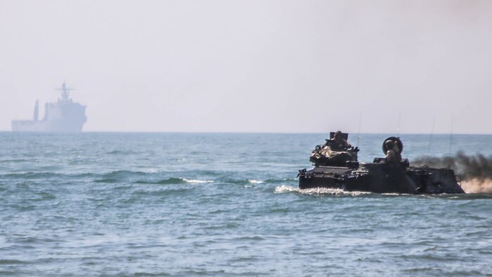 Marines with 2nd Assault Amphibious Battalion, 2nd Marine Division, drive assault amphibious vehicles to shore from the USS Whidbey Island during amphibious training operations in the waters off the coast of Camp Lejeune, N.C., July 16, 2015. The exercise allowed Marines to fulfill their required ship operations and gave sailors aboard the Whidbey Island the opportunity to work with Marines during their own amphibious training.