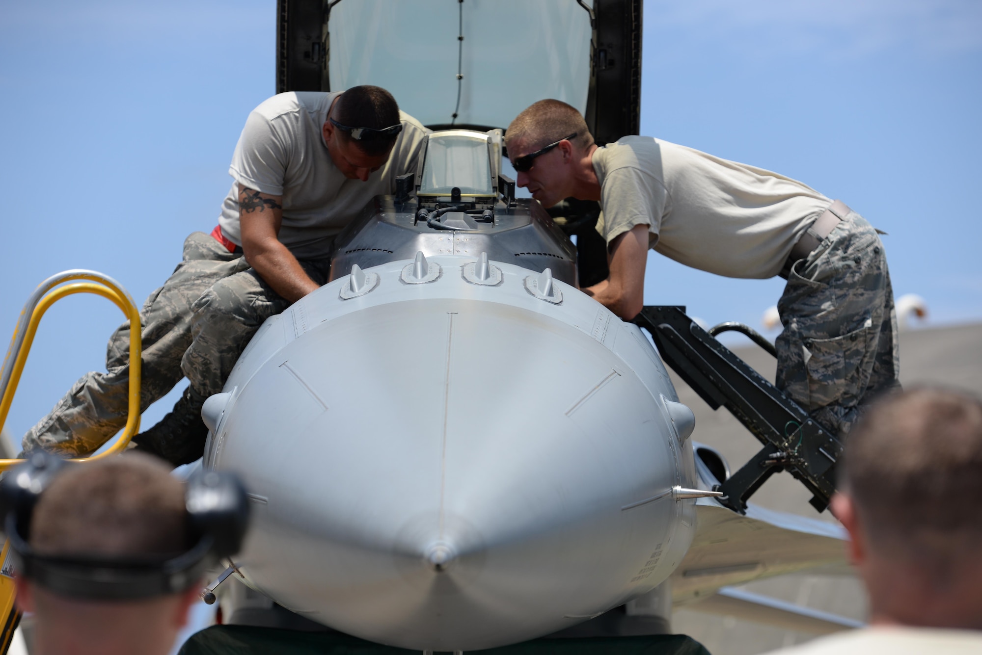 Guardsmen from the 158th Fighter Wing Air National Guard check the flight systems of an F-16 Fighting Falcon on Kadena Air Base, Japan, July 16, 2015. The Vermont Air National Guard, also known as the Green Mountain Boys,are currently deployed to Kadena Air Base, are currently deployed to Kadena to enhance regional security in the Indo-Asia-Pacific region and demonstrate the U.S. commitment to stability in the region. (U.S. Air Force photo by Senior Airman Omari Bernard/Released)
