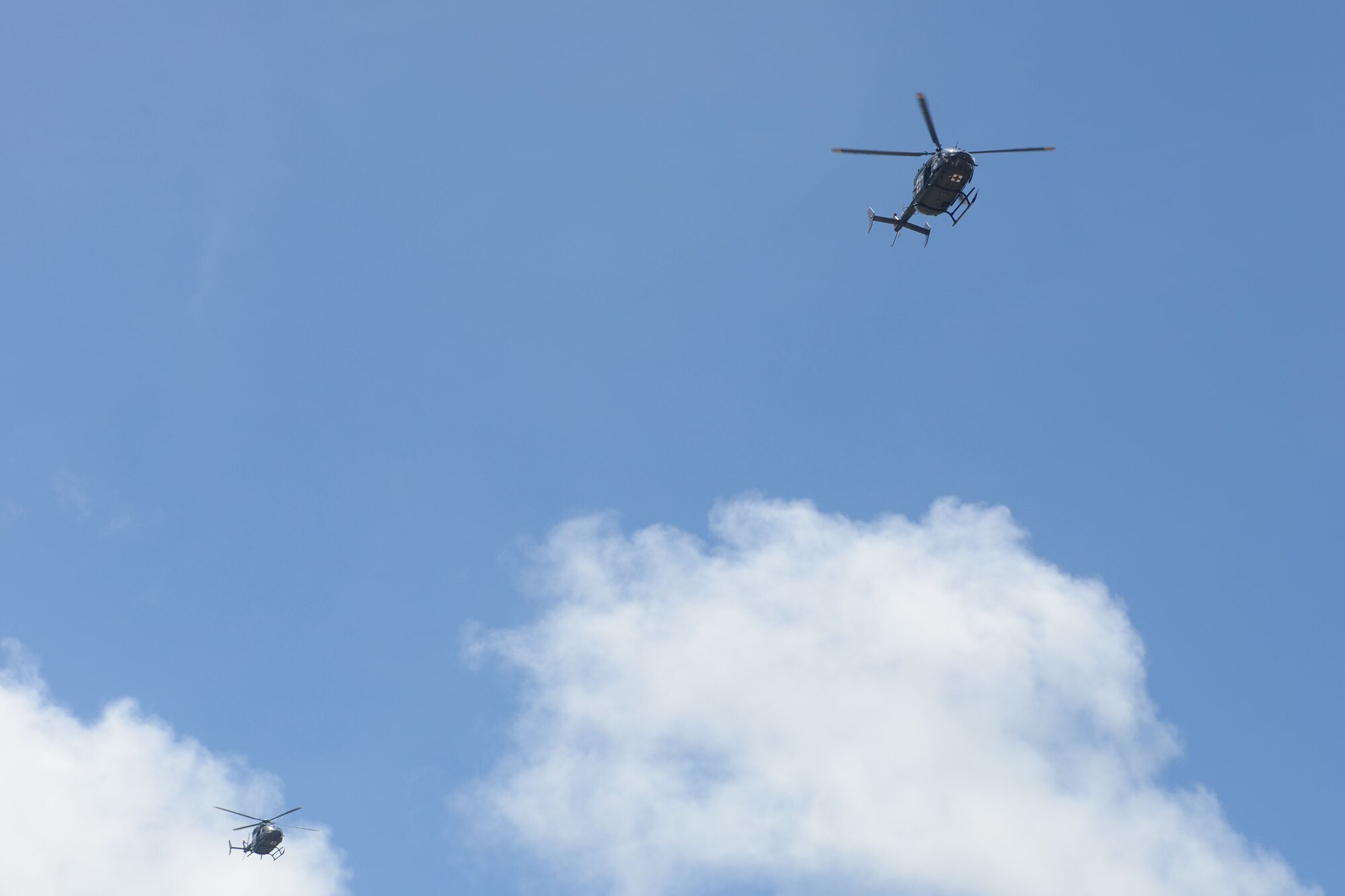 Helicopter Sea Combat Squadron 25 aircrew members fly MH-60S Knighthawks over Hagåtña, Guam, in the Liberation Day Parade, July 21, 2015. Liberation Day is celebrated in honor of the World War II Chamorro generation and to show gratitude to the U.S. for returning to rescue Guam as it suffered the atrocities of the Japanese occupation. (U.S. Air Force photo by Airman 1st Class Alexa Ann Henderson/Released)