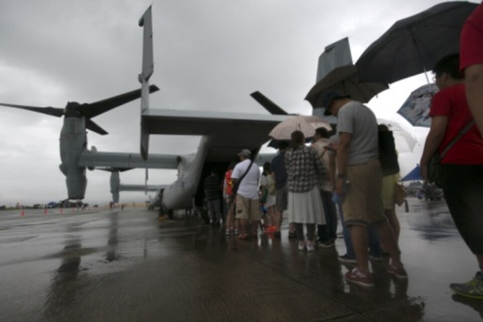 Okinawa residents wait in line to board and tour an MV-22B Osprey June 6, during the Futenma Flightline Fair on Marine Corps Air Station Futenma, Okinawa, Japan. Along with the Ospreys, the guests were also able to tour and meet the crew members of a KC-130J Super Hercules, an HH-60 Pave hawk, and various other aircraft. According to Col. Peter Lee, the Commanding officer of MCAS Futenma, it’s not only important that the Okinawa residents know about the aircraft on MCAS Futenma, but also the Marines who work on them.