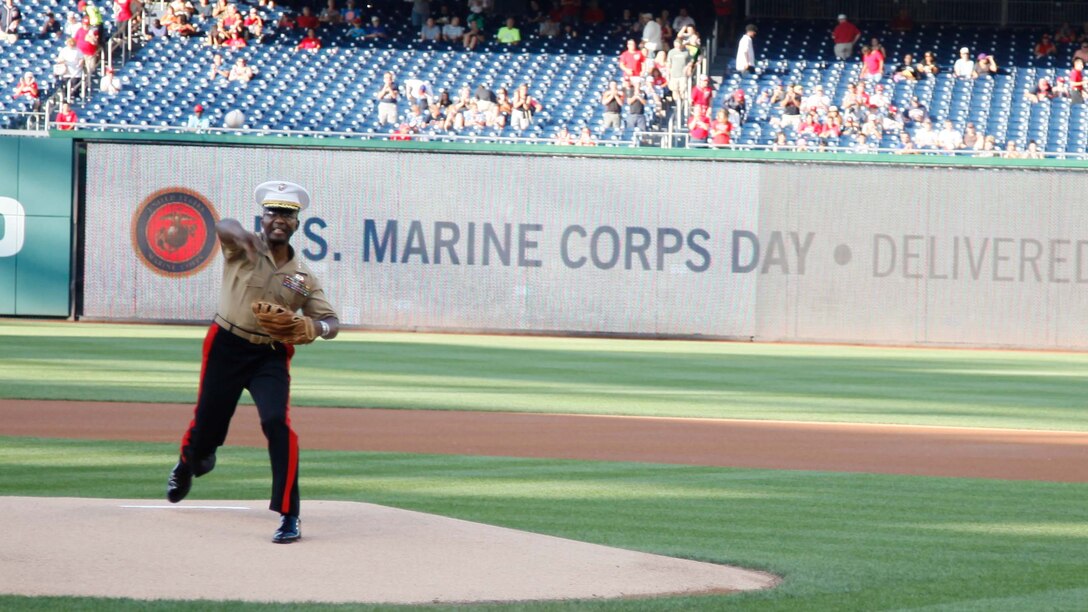 Lieutenant Gen. Ronald Bailey throws the opening pitch during Marine Corps Day, July 21, 2015, at Nationals Park in Washington. The Washington Nationals hosted a Marine Corps Day to honor Marines who serve and who have served in the past. Lieutenant Gen. Bailey is the deputy commandant, Plans, Policies and Operations, Headquarters Marine Corps. 