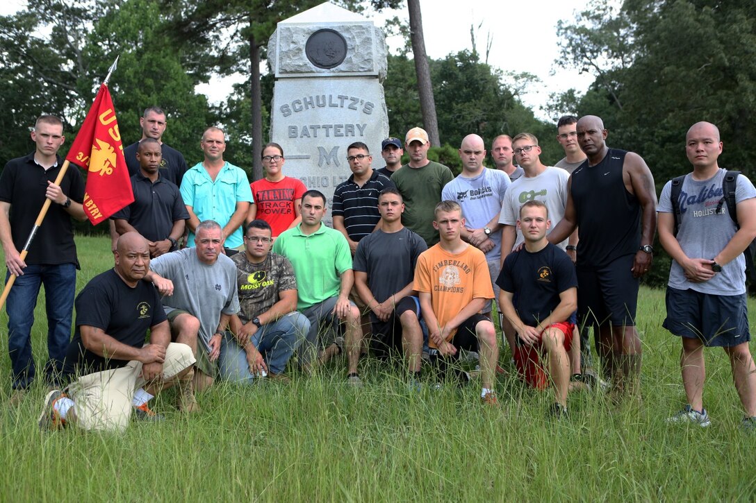 The Marines of Battery M, 3rd Battalion, 14th Marine Regiment pose for a picture with Col. Joseph Russo, commanding officer of 14th Marine Regiment, in front of Schultz’s Battery M monument at Chickamauga and Chattanooga National Military Park in Fort Oglethorpe, Georgia, July 20, 2015. The Marines gathered together at the park to not only honor the Marines and Sailor killed by a gunman at the Naval Operational Support Center and Marine Corps Reserve Center, but to band together as a unit. 