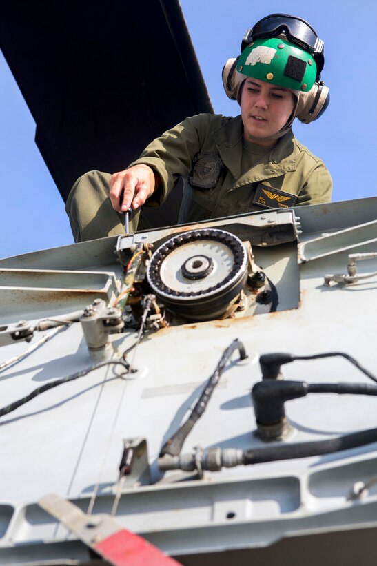 Marine Corps Lance Cpl. Delia L. Hanna disassembles part of a CH-53E Super Stallion helicopter during a routine maintenance check on Marine Corps Air Station Cherry Point, N.C., July 10, 2015. Hanna is an airframe mechanic assigned to Marine Heavy Helicopter Squadron 366.