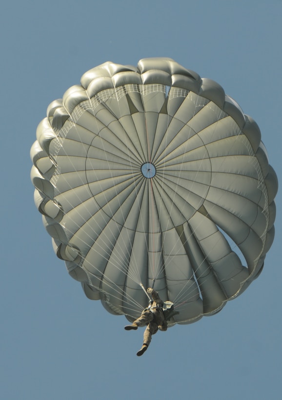 A soldier nears the ground during his unit’s last jump on over Little ...