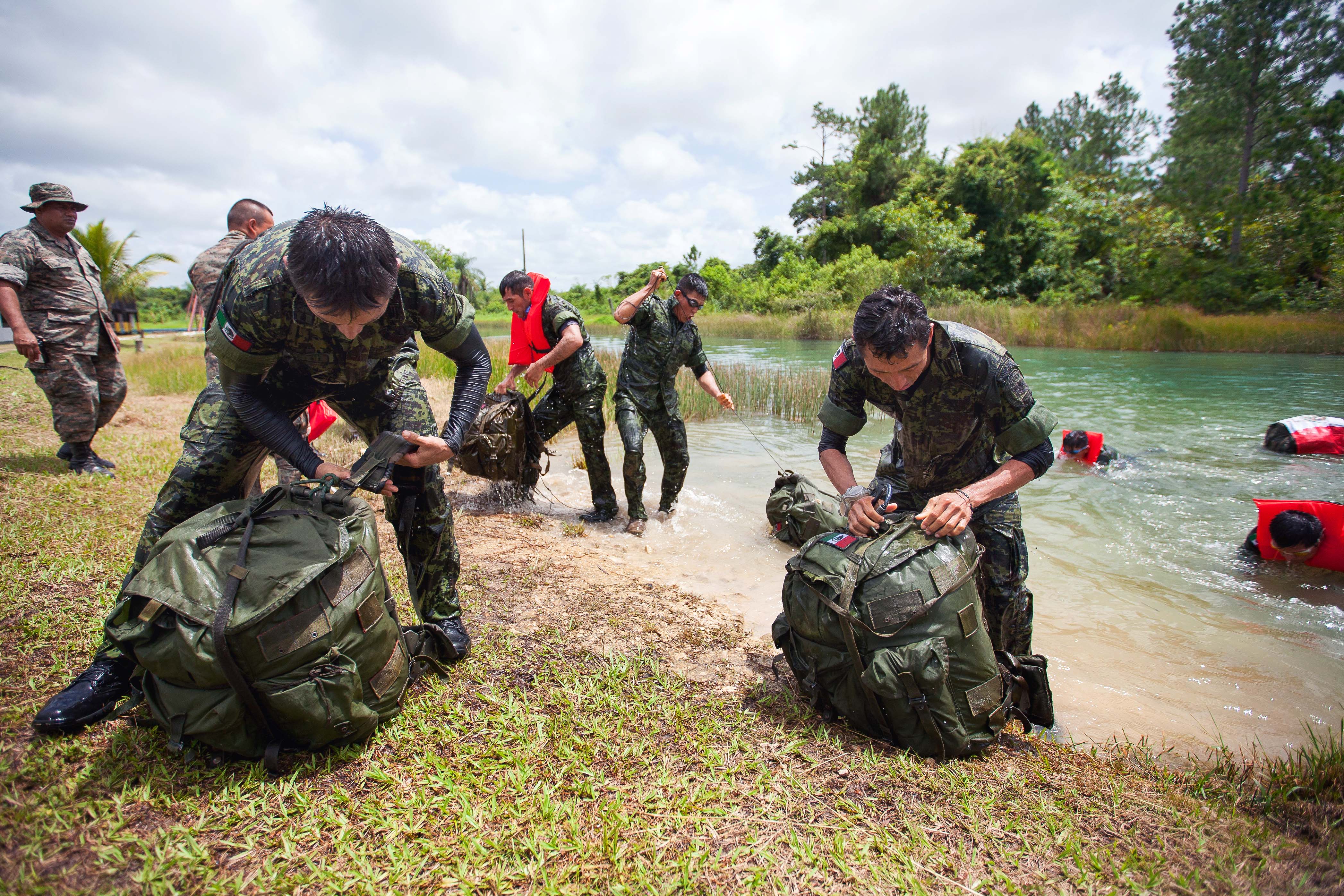 Mexican navy special operations personnel prepare their gear after