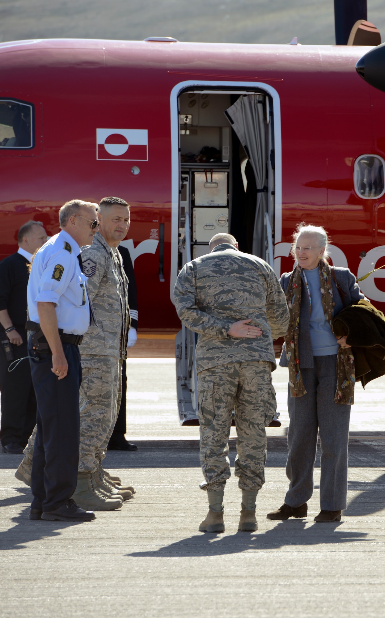 THULE AIR BASE, Greenland – Her Majesty The Queen of Denmark Margrethe II, thanks Col. Stuart Pettis, 821st Air Base Group commander and senior U.S. official in Greenland, as she prepares to depart Thule Air Base, Greenland on July 11, 2015. The Queen toured several Thule facilities during her visit. (U.S. Air Force photo by Tech. Sgt. Jared Marquis)