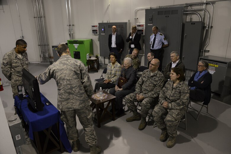 THULE AIR BASE, Greenland – Her Majesty The Queen of Denmark Margrethe II, is briefed about the mission of Detachment 1, 23rd Space Operations Squadron at Thule Air Base, Greenland, by Capt. Theodore Givler, Det. 1, 23rd SOPS commander on July 11, 2015. Following the briefing, the Queen received a tour of the facility. (U.S. Air Force photo by Tech. Sgt. Jared Marquis)
