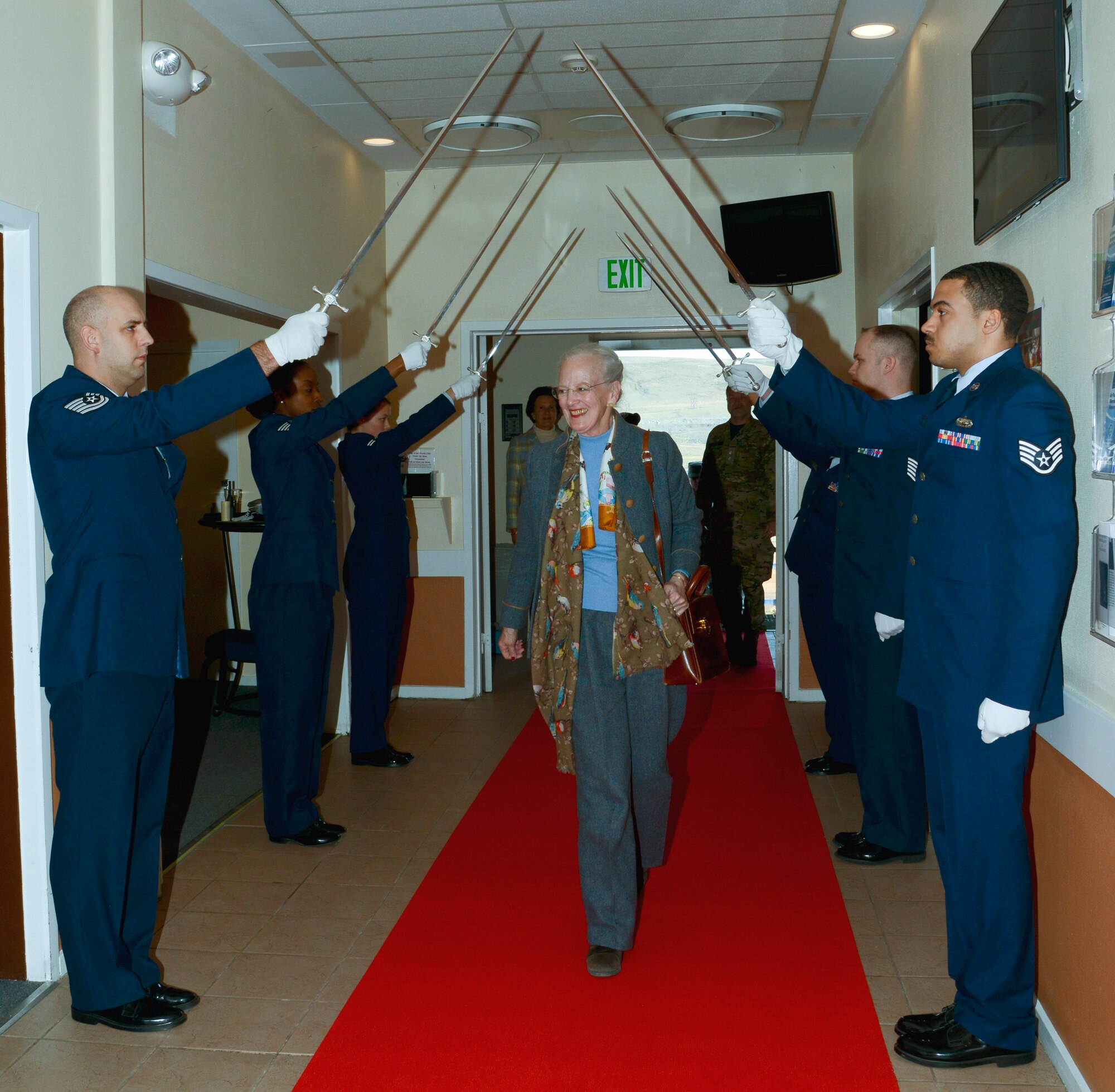 THULE AIR BASE, Greenland – Her Majesty The Queen of Denmark Margrethe II is honored with a parade by the Thule Air Base Honor Guard during a visit here July 10, 2015. The Queen received a mission brief and toured several base facilities during her visit. (U.S. Air Force photo by Tech. Sgt. Jared Marquis)