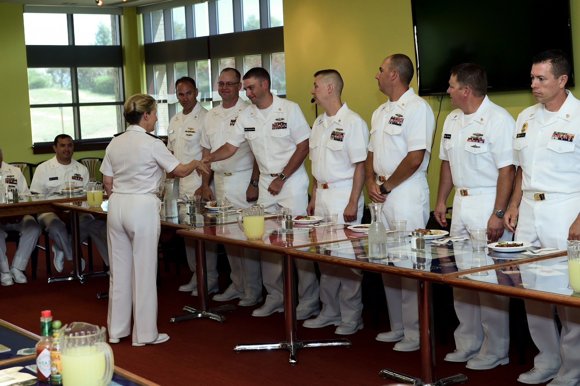 Vice Adm. Robin R. Braun, Chief of Navy Reserve and Commander, Navy Reserve Force, greets members of the Chief’s Mess before lunch July 19, 2015, at the Panthers Den on Buckley Air Force Base, Colo. This event was part of Braun’s visit to the Navy Operations Support Center, Denver, one of several visits to Front Range Navy Reserve units celebrating the Navy Reserve Corps’ 100th anniversary.  (U.S. Air Force photo by Senior Airman Phillip Houk/Released)