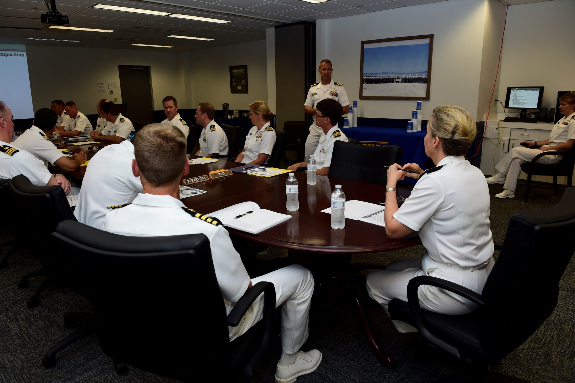 Vice Adm. Robin R. Braun, Chief of Navy Reserve and Commander, Navy Reserve Force, receives updates from unit commanders associated with the Navy Operations Support Center, Denver July 19, 2015, on Buckley Air Force Base, Colo. This meeting was part of Braun’s visit to Front Range Navy Reserve units celebrating the Navy Reserve Corps’ 100th anniversary.  (U.S. Air Force photo by Senior Airman Phillip Houk/Released)